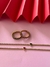 Anillos rodinados en dorado sin fin con rubí y esmeraldina