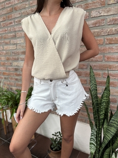 Blusa cruzada hombreras