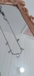 Choker de flores em aço inox com um pingente de cristal