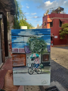 Hombre en bici con sombrilla (obra original) - comprar online