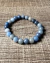 Pulseira em Quartzo Azul 8mm - Calma e Bem-estar na internet