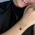 Pulseira Trevo Preta Banhada a Ouro - comprar online