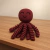Naninha fofinha de polvo em crochê magenta