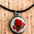 Colar relicário com Mini rosa vermelha fundo prateado fio camurça preto - comprar online