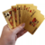 Baralho Dólar a Prova D'água da FreeTime® com cartas douradas na mão de uma pessoa.
