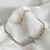 Pulsera Cruz Microcircones Plateada