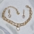 Conjunto Pulseira Dupla e Brinco com Zircônia Coração na internet