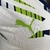camisa-manchester-city-edicao-especial-23-24-jogador-puma-masculina-branca-com-detalhes-em-azul-e-verde