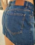 Pollera Mini azul oxido con roturas tiro bajo