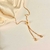 Pulseira gravatinha com zircônia coração folheada a ouro 18k