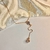 Colar gravatinha com zircônias folheado a ouro 18k