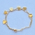 Pulsera corazón acero dorado