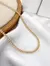 Choker Riviera Cravejada com Zircônias navetes em Ouro 18k