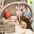Arco Barral Musical Multisensorial para cochecito Taf toys - Tokema Toys