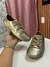 Tênis em couro. Dourado. SOULIER.