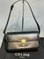 Bolsa Celine Claude - preto com dourado - comprar online