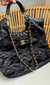 Bolsa CH - preta com dourado na internet