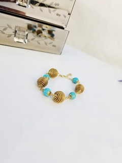 Pulseira Dourada e Turquesa na internet