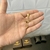 PINGENTE CRUZ AMARRADA - M - 4x2,5cm - Banhado a Ouro 18k na internet
