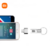 Pen drive Xiaomi original em metal com conexão USB Tipo-C ao lado de um celular exibindo tela de música