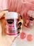 Frasco do produto Bolinha Explosiva Xana Loka da marca HotFlowers, com destaque para a embalagem colorida e atraente, contendo bolinhas rosa ao fundo.