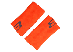 Muñequera Bullpadel de 15cm en color naranja fluor.