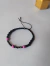 Pulsera cristales negros y fucsia. Regulable de 19 a 22 cm - comprar online