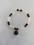 Pulsera dije negro.