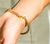 Pulseira Efeito Corda Ouro 70mm - comprar online