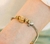 Passador Pomba da Paz Ouro com Resina Pérola 13mm - comprar online