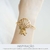 Pulseira Concha Pequena Vazada Ouro 69mm - comprar online