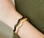 Pulseira Onda Ouro com Pérola 68mm - comprar online