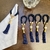 Porta guardanapo em cordão azul marinho, pérola e tassel - comprar online