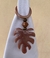 Porta guardanapo em resinas cor caramelo modelo costela de Adão - comprar online