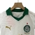 Conjunto infantil de futebol do Palmeiras, composto por camisa branca e short verde, da marca Puma.