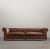 Sillón Chesterfield con diseño clásico y tapizado en cuero marrón, ideal para living o sala de estar