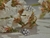 Aros Flor con Strass Blanco