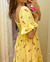 Vestido amarelo floral com lastex - comprar online