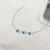 Pulseira entremeios olho grego azul 7mm