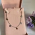 Choker de aço 7 coraçoes 47 cm regulável