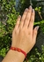 Pulseira macrame vermelha com miçangas regulável na internet