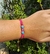Pulseira macrame rosa com miçangas regulável na internet