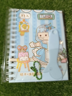 caderno de adesivo