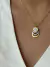 Collar reloj madre perla