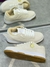 Tênis Nike Dunk Low bege na internet