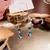 Pendientes largos de flecos con gema de zorro azul real para mujer
