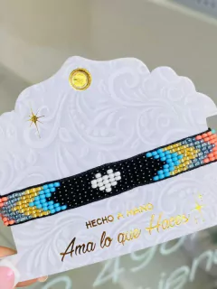 Manilla mostacilla negra corazón blanco