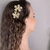 Par de Presilhas Flor Metalizado - comprar online