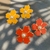 Brinco Flor C/ Perola Resinado