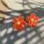 Brinco Flor C/ Perola Resinado na internet